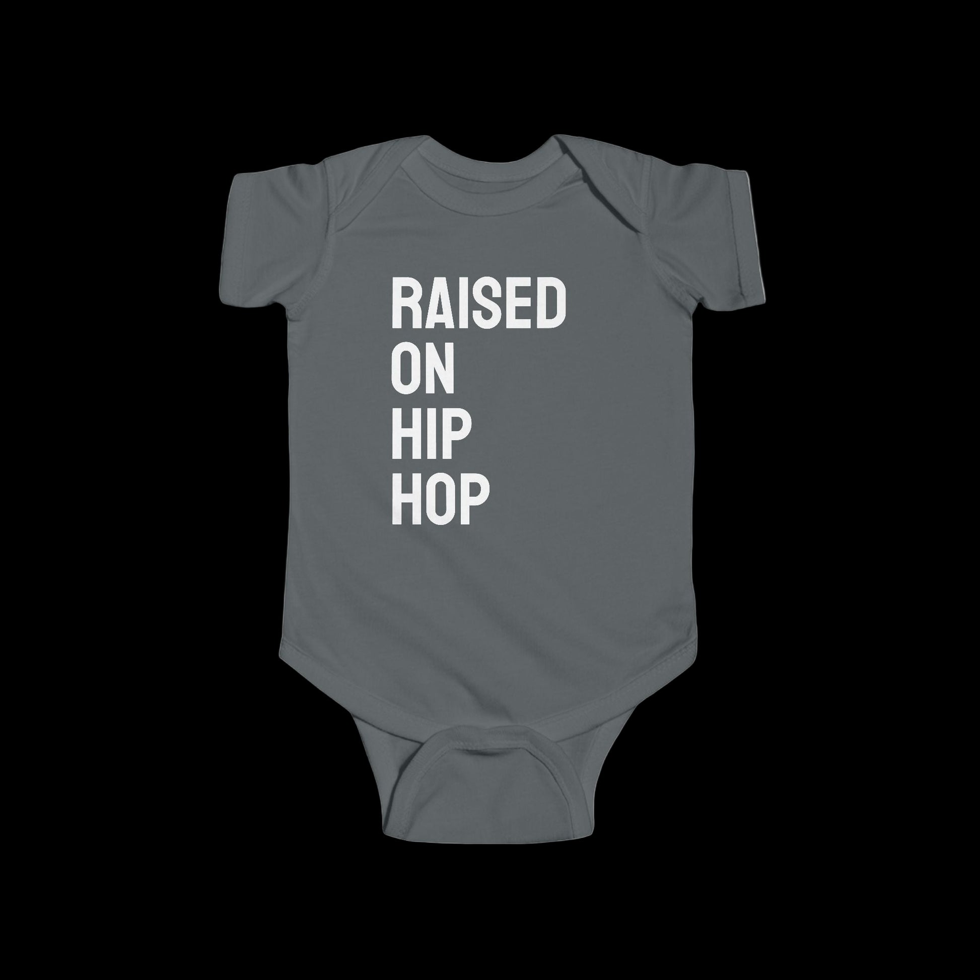 Gray baby onesie with 'Raised on Hip Hop' text on a white background