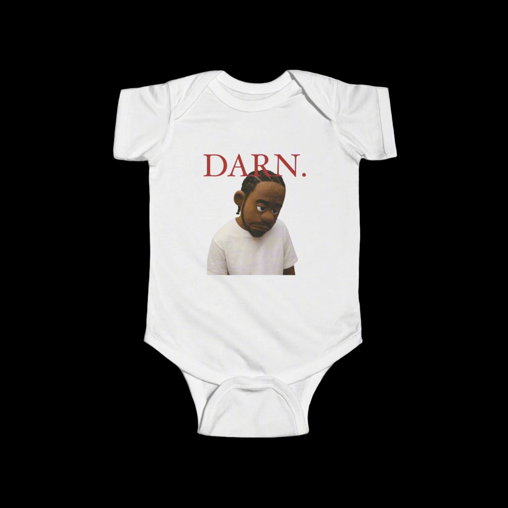 White baby onesie with a graphic of a child and the word 'DARN.' in red on a black background.