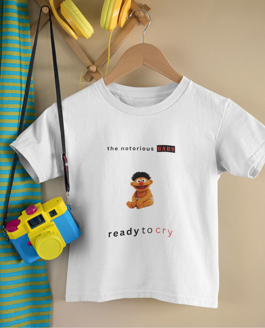 White t-shirt with Sesame Street character design on a hanger with accessories.